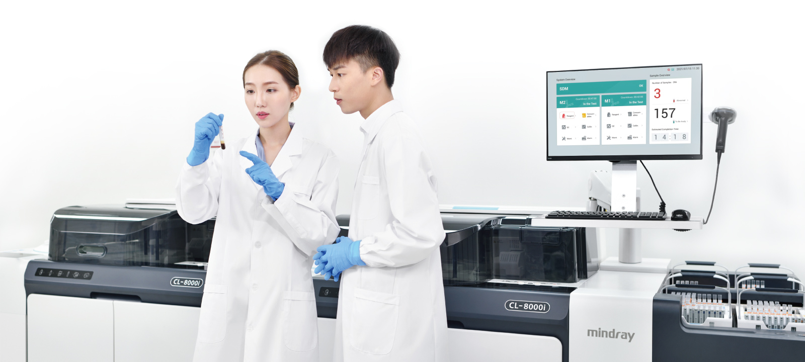Two lab experts analyzing samples using Mindray CL-8000i analyzer