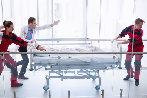 Man is reaching his hand to push fire alarm hand station